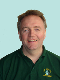Paul Maguire, owner of Mr Useful Bathrooms, in a green work polo shirt